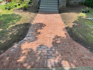 Lumen Landscaping | Interlock Red interlock walkway leading to the front steps