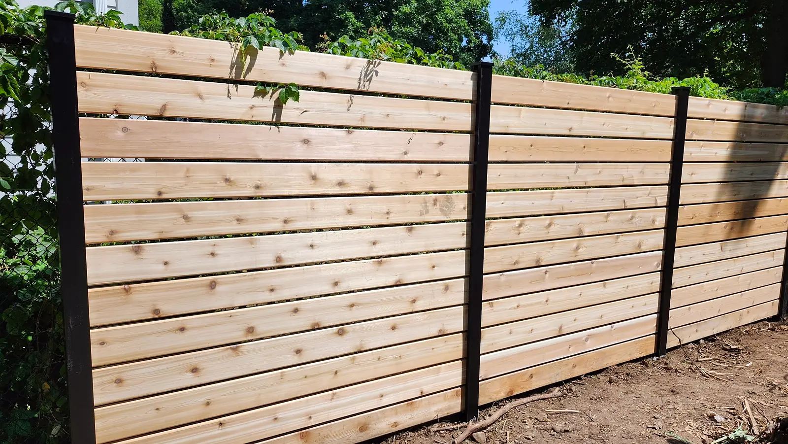 Lumen Landscaping | Fences and Gates Horizontal cedar fence built by Lumen Landscaping